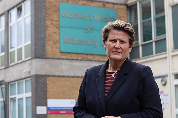 Sarah Dyke MP standing outside of a medical building.